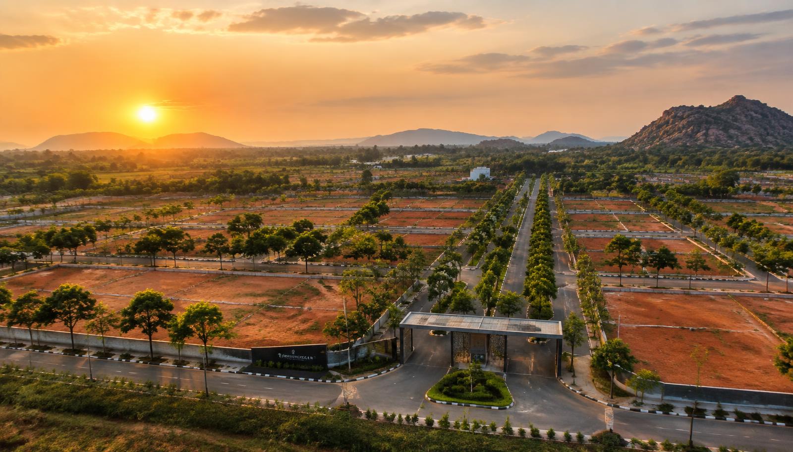 Aerial view of a landscaped UrbanEarth plotted community at golden hour